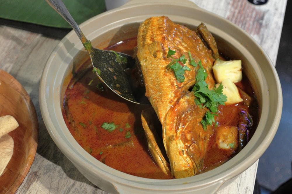 A bowl of fish head curry from Muthu’s Curry.