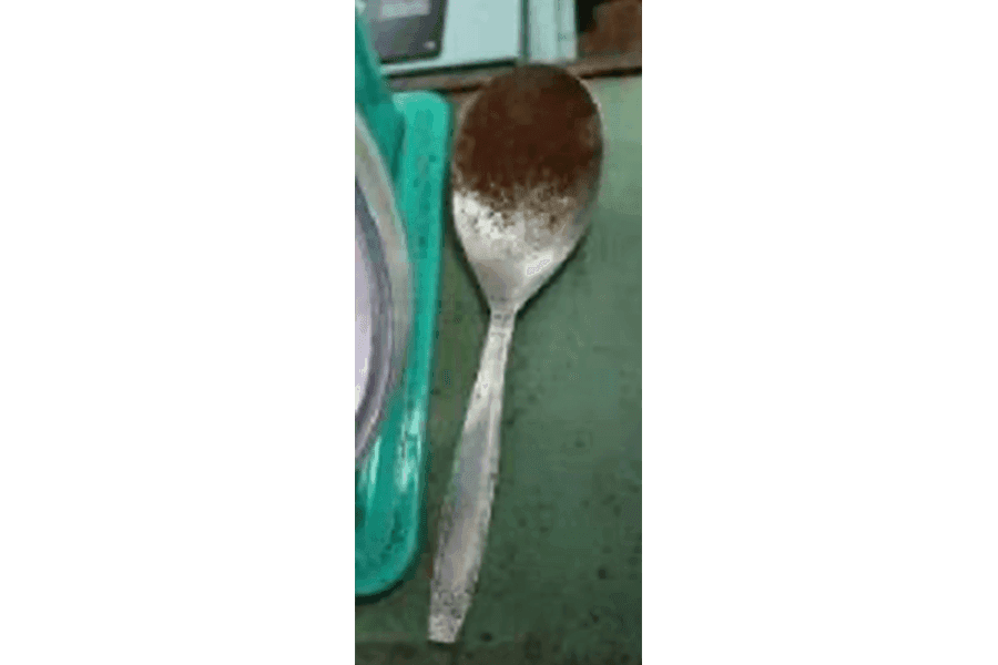 This small metal scoop is used by Benny Tan, the founder&rsquo;s grandson, to measure and portion out coffee beans for walk-in customers.