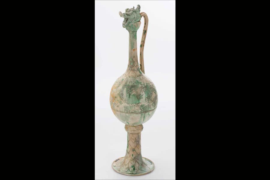 <strong><a href="/stories-landing/stories/the-singapore-story-through-60-objects/networks-through-time/ewer/story" target="_blank"><strong>Green Décor Hu Ewer with snake-shaped long handle and dragon head lid, North China, Tang Dynasty (618-907).</strong><br>
Tang Shipwreck Collection, collection of the Asian Civilisations Museum.</a></strong>