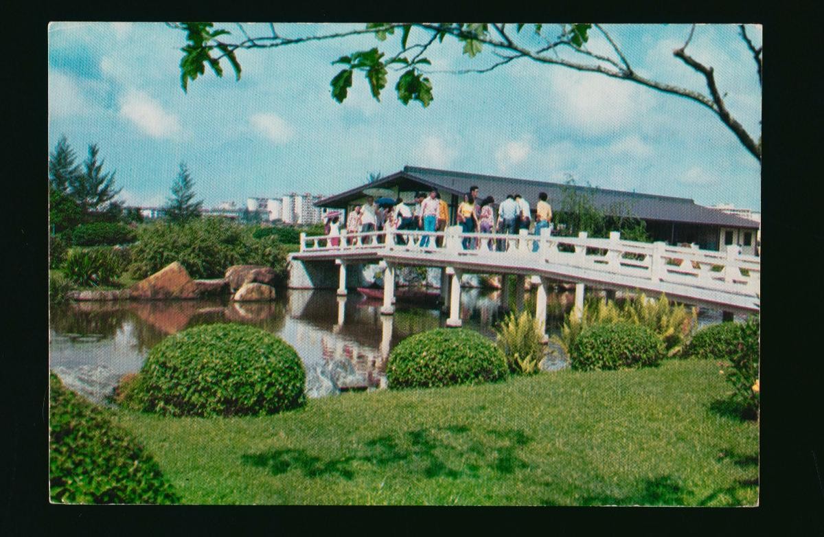 An arched bridge and guest house in the Seiwaen Japanese Garden at Jurong