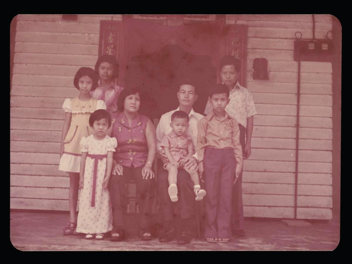 Photograph of the Tan family outside the family house along Lorong Andong