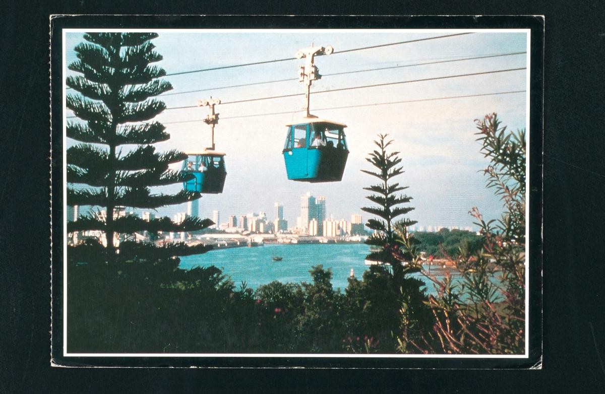 Sentosa cable cars with view of city skyline