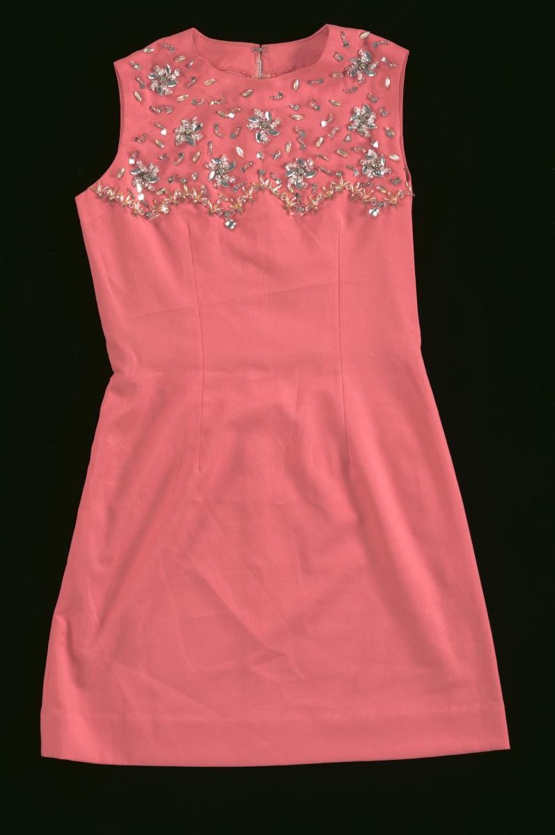 A red sleeveless mini dress with sequins and beads