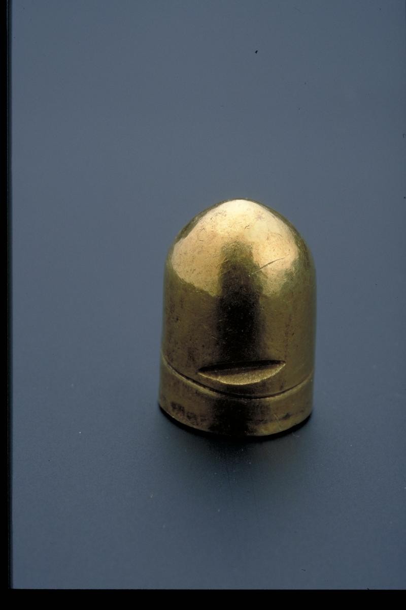 Miniature gold lingam