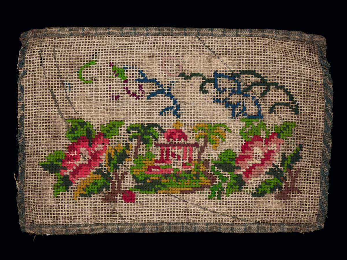 Needlework sampler with motif of a domed-shaped structure with flowers and trees