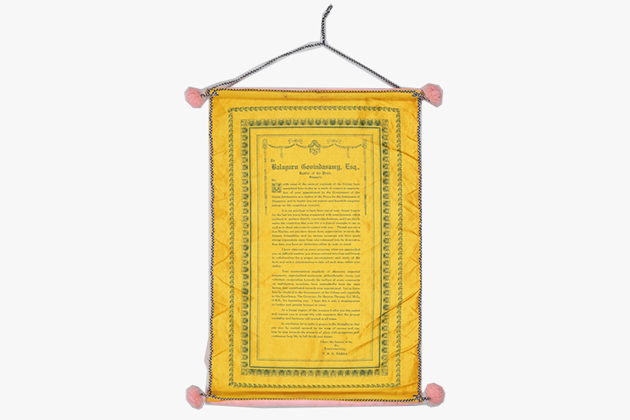 <a href="/assets/ab4460af-0265-4965-995b-4292717073bd/5b-b033.jpg"><strong>A scroll with scroll holder bearing the inscription “Presented by TAC Pasha of Madras as a Token of Friendship to B Govindasamy Esq JP on the occasion of Tea Party Given in his honour at the Adelphi Hotel on 28th July, 1930”</strong></a><br>
28 July 1930, Singaproe<br>
<em>Collection of the Families of B Govindasamy Chettiar and SL Perumal</em>
