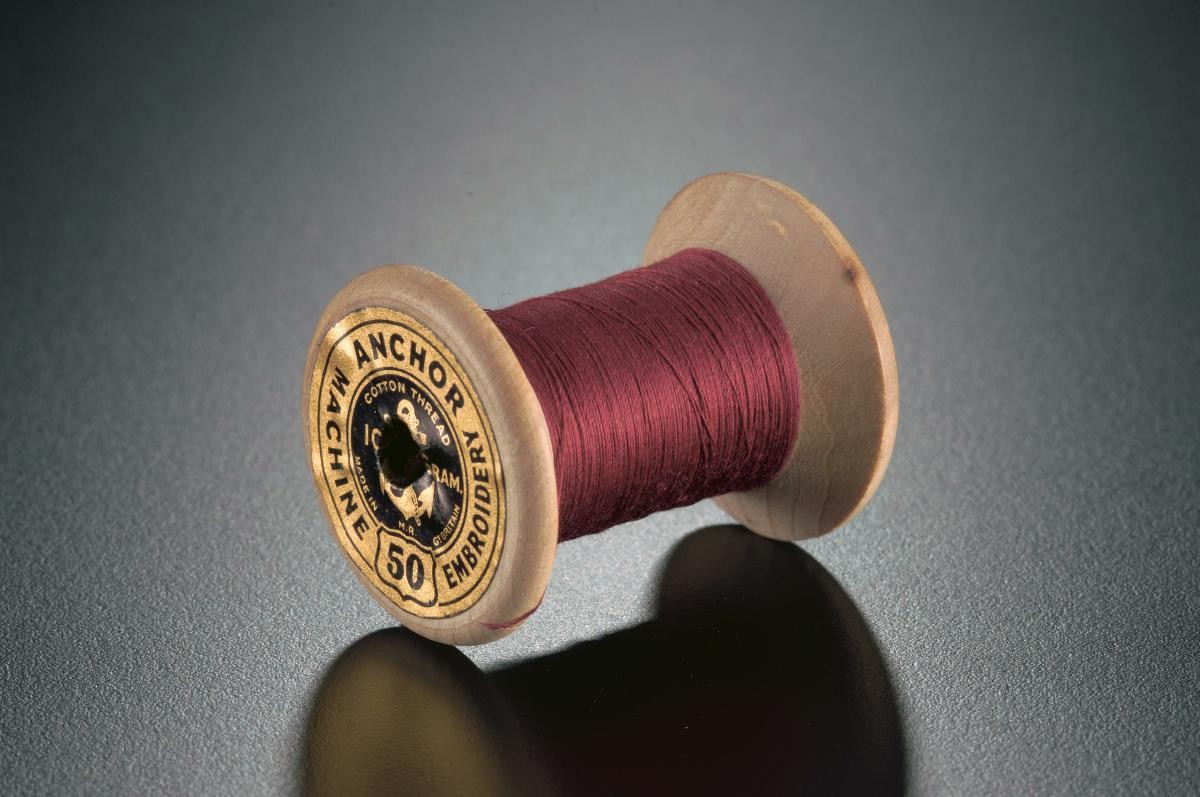 A spool of machine embroidery thread from Clark & Co’s Anchor Mills in Paisley
