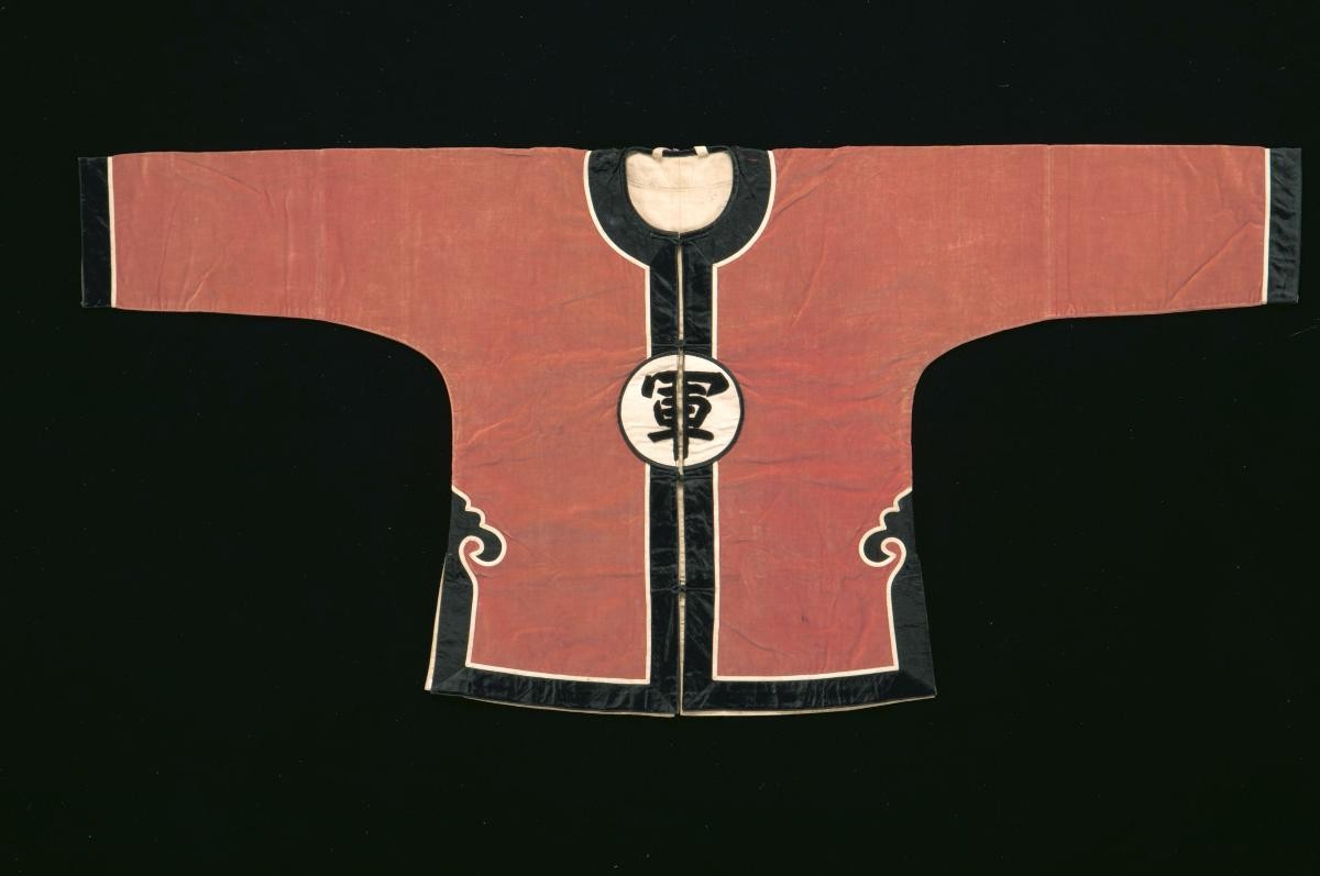 An orange and black top worn by a soldier in a Chinese opera