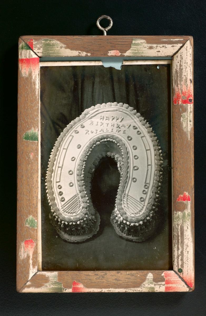 Framed photograph of a birthday cake
