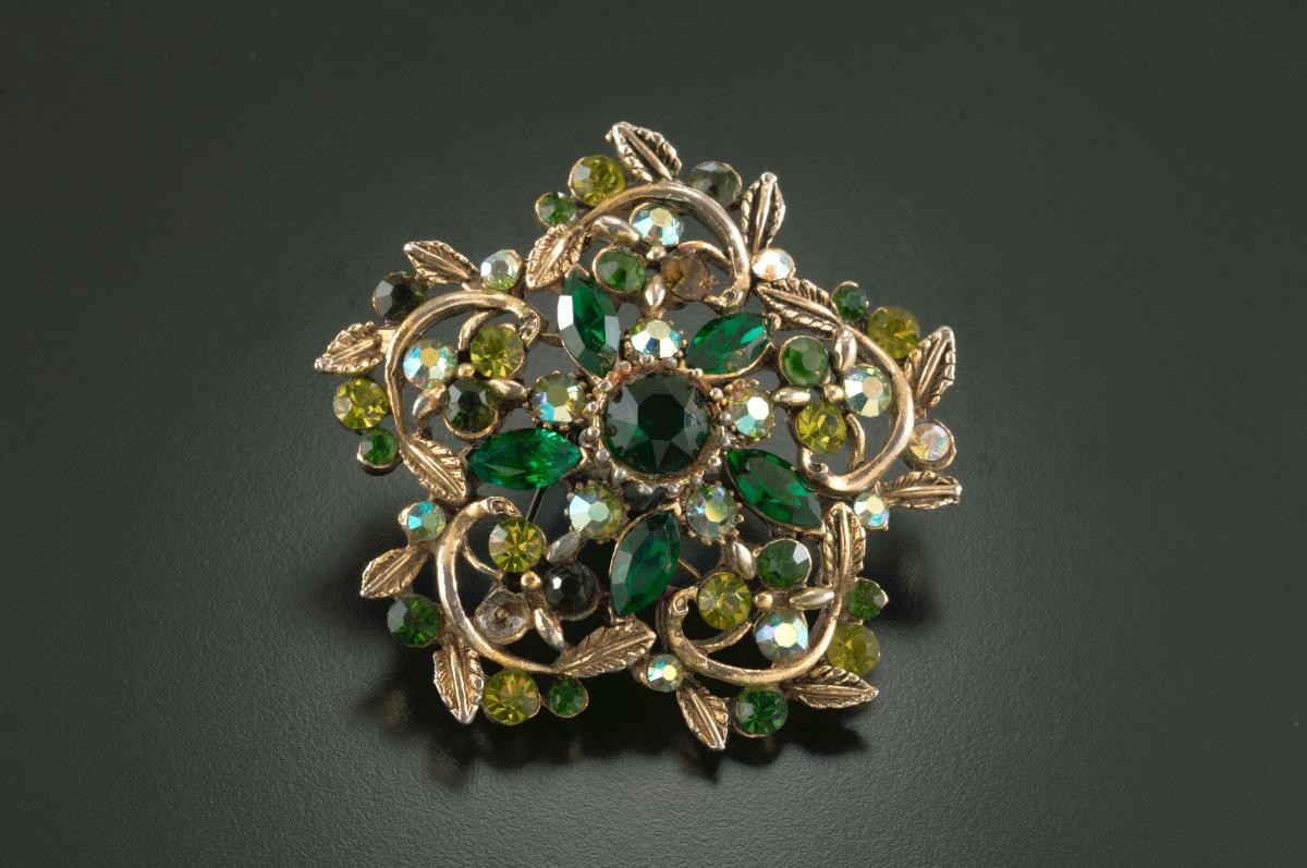 Green diamanté brooch that belonged to a notable women's rights activist