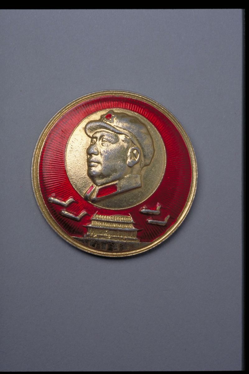 Badge featuring historical milestones of the communist revolution