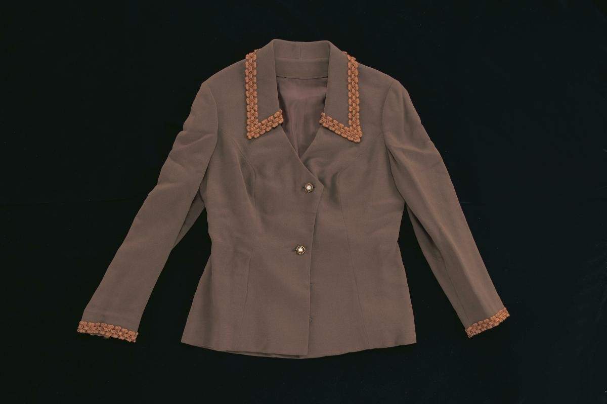 A brown jacket with lace
