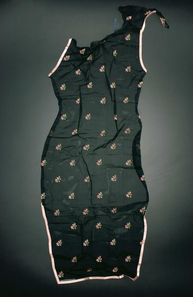 Unfinished black cheongsam with light pink embroidered flowers