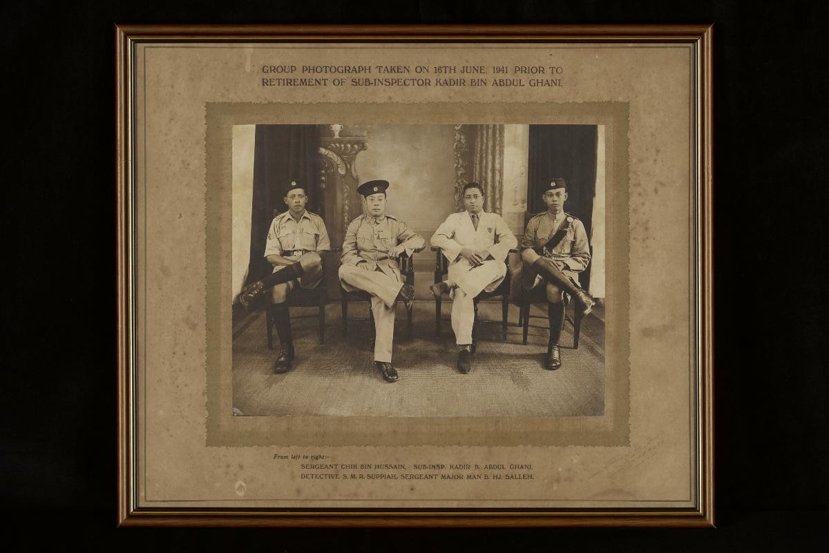 Framed photograph of Ramasamy Suppiah and police colleagues