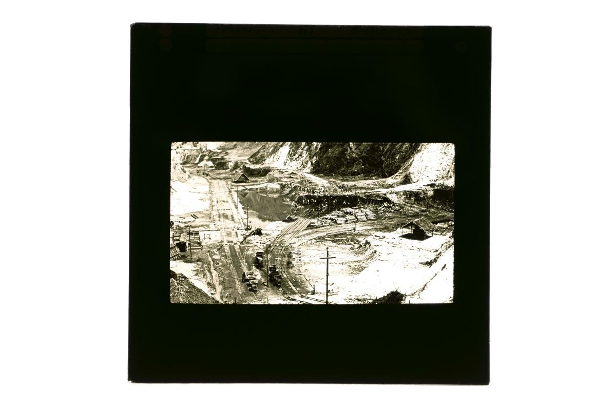 A glass lantern slide depicting a view of a construction project