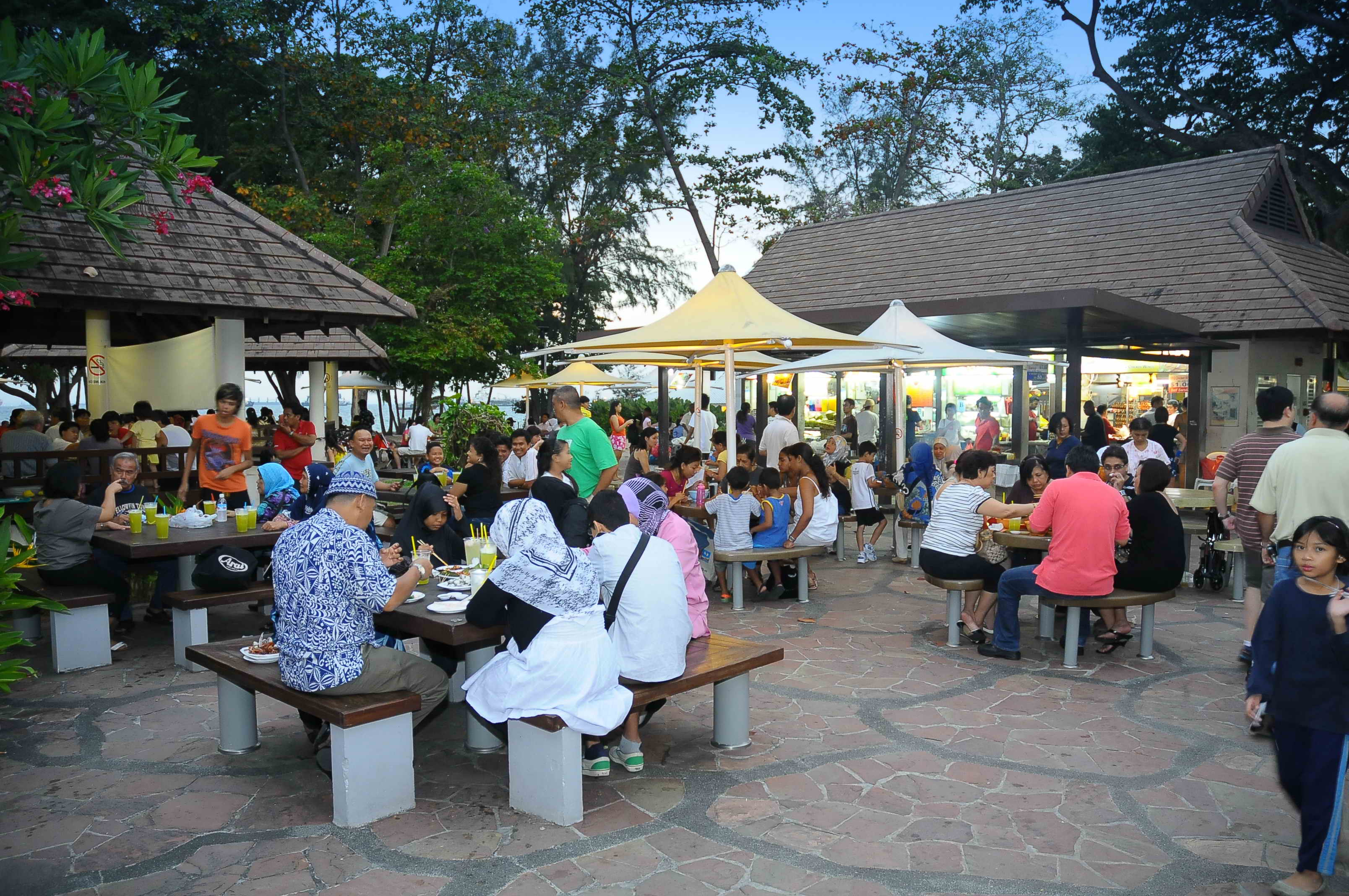 Families and friends dining and mingling at East Coast Lagoon Food Village.