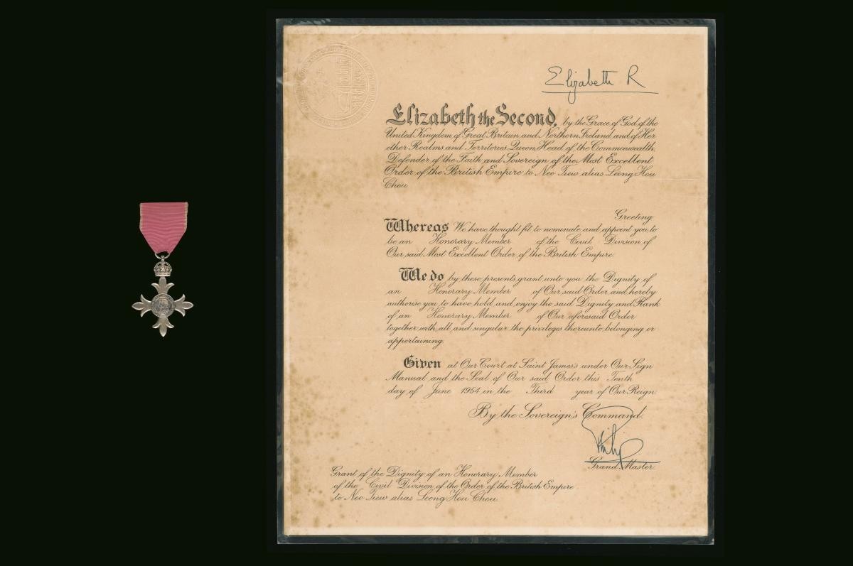 Medal with an accompanying certificate for the Order of the British Empire (OBE) awarded by Queen Elizabeth II to Neo Tiew