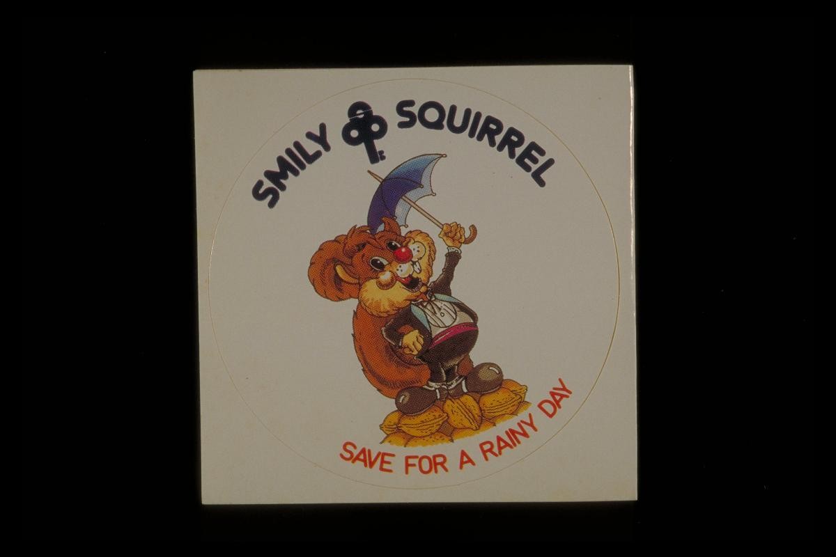 ‘Smiley Squirrel’ sticker with slogan, ‘Save for a rainy day’