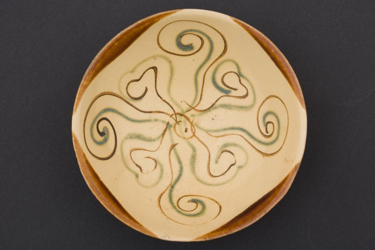 Bowl with abstract floral rosette