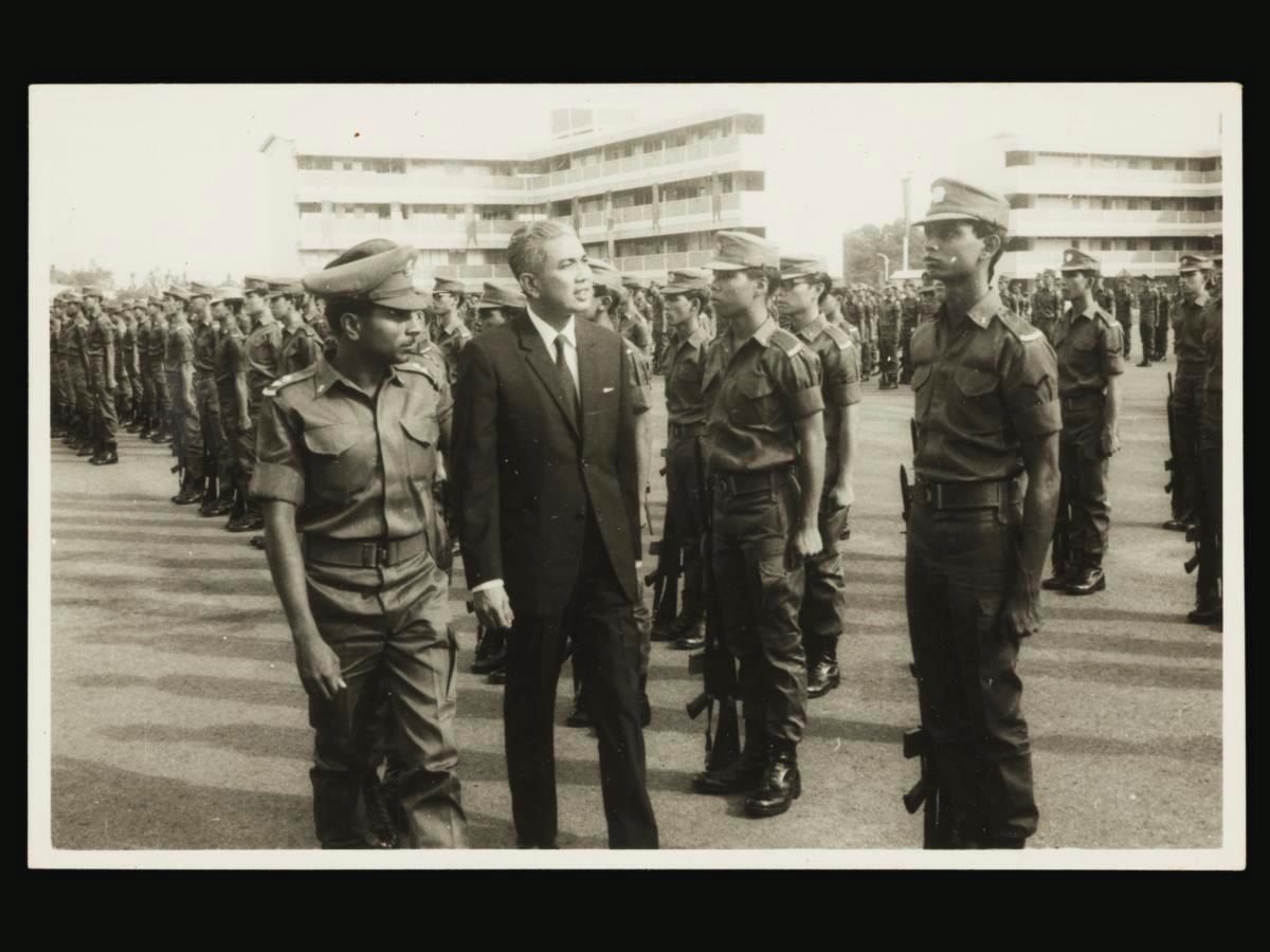 Mr Rahim Ishak inspecting the first batch of national servicemen of Unit 45IR at Bedok Camp, accompanied by Lt. Ponnosamy Kalastree
