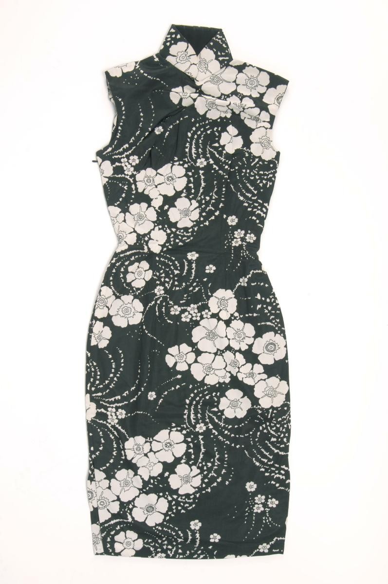 A black sleeveless cheongsam with white floral motifs