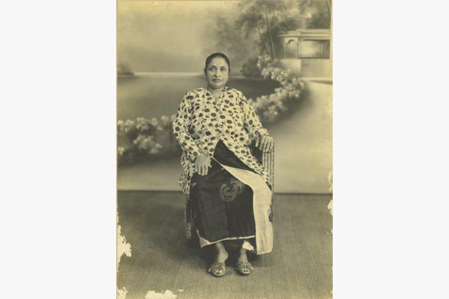 <a class="bold" href="/assets/f45ce5dd-2d86-403d-a791-36196b7d7b20/a-photograph-of-guramah-a-chetti-melaka-matron-wearing-baju-panjang-and-sarong.jpg" target="_blank">
A studio photograph of Kathai Ammal, wife of Ramasamy Suppiah, wearing <i>sarong kebaya
</i></a>