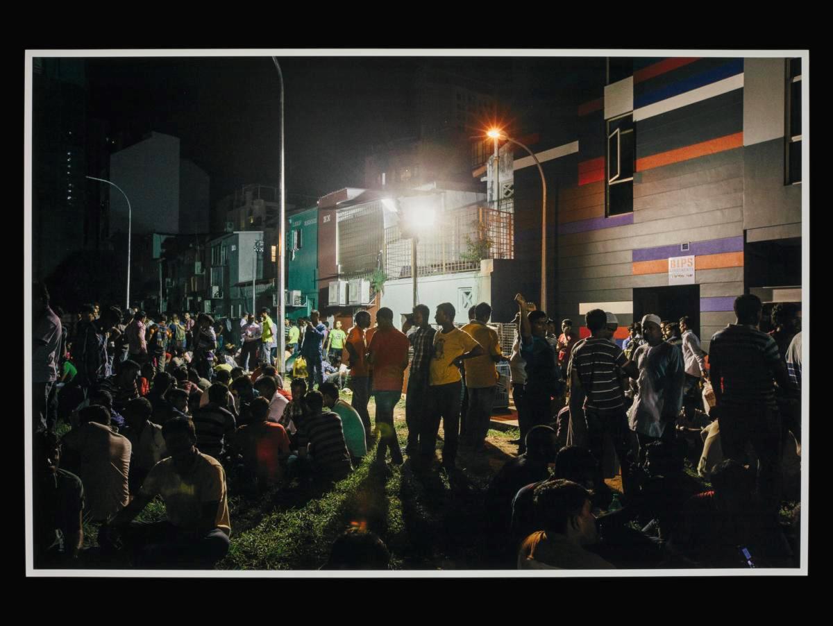 Riot Recollections - View of migrant workers gathering at a back alley in Little India on a weekend