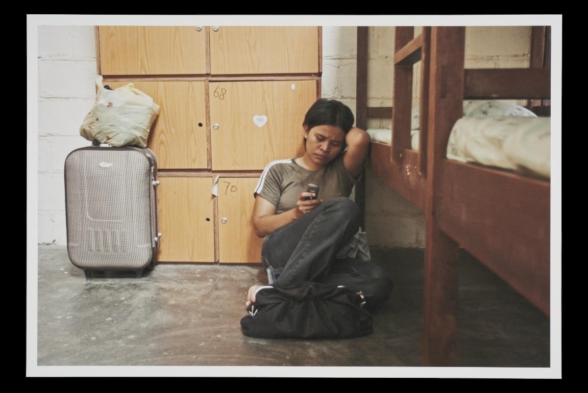 Photograph of Sugiyani Waryomiharjo in her dormitory at a Jakarta training centre for Indonesian domestic helpers