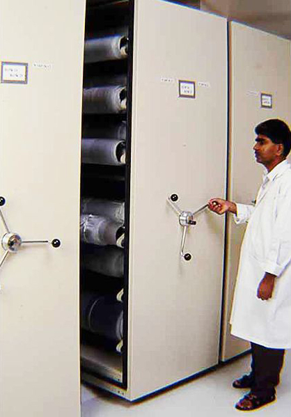 <p style="color: #000000; margin: 0cm 0cm 8pt;"><span>Collections Manager, Raj opening the compactors to retrieve a piece of textile in the Textile Store.</span>