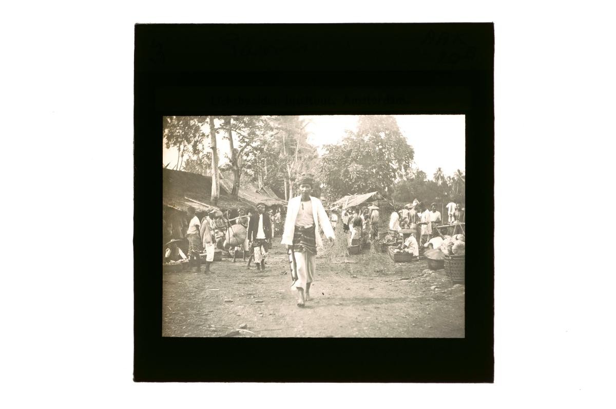 A glass lantern slide depicting a village market