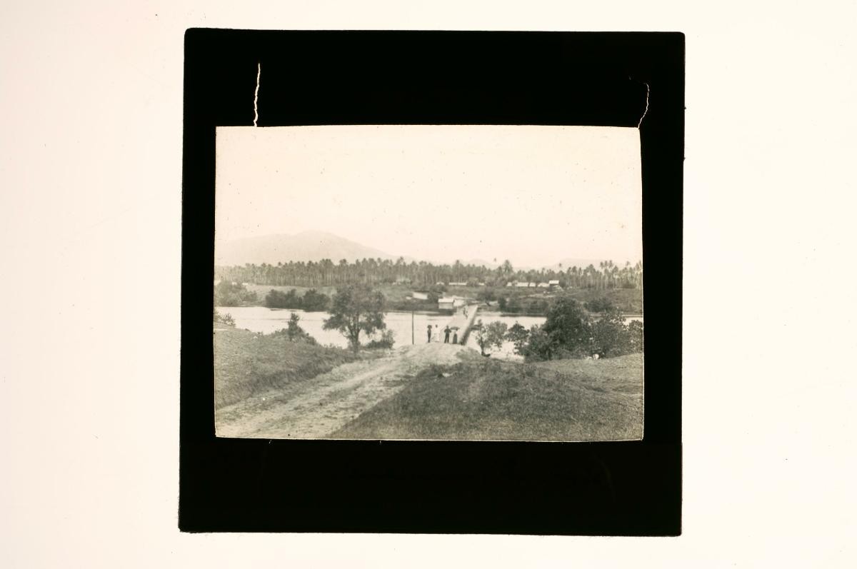 A glass lantern slide depicting a river scene