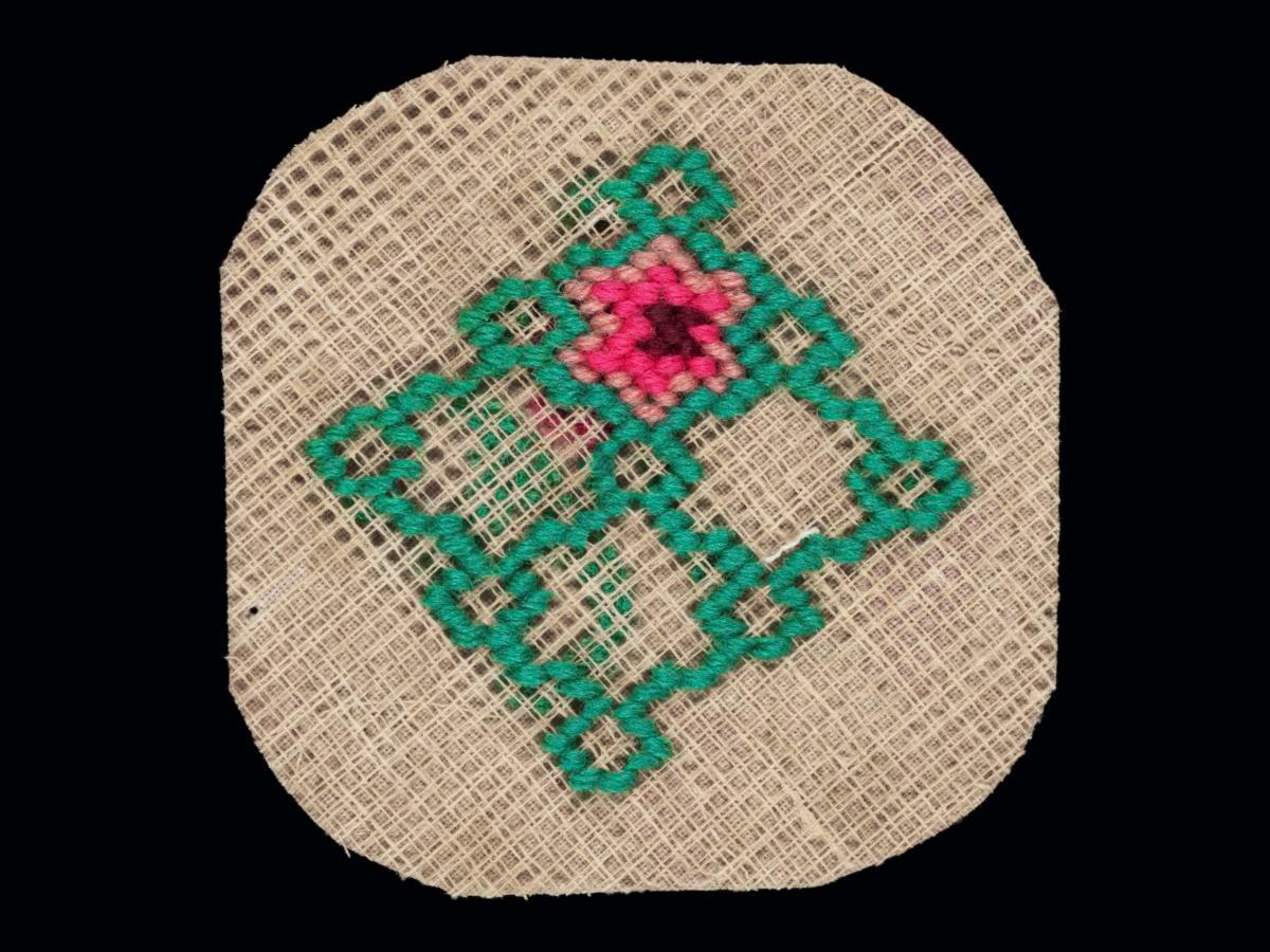 Needlework sampler with geometric pattern