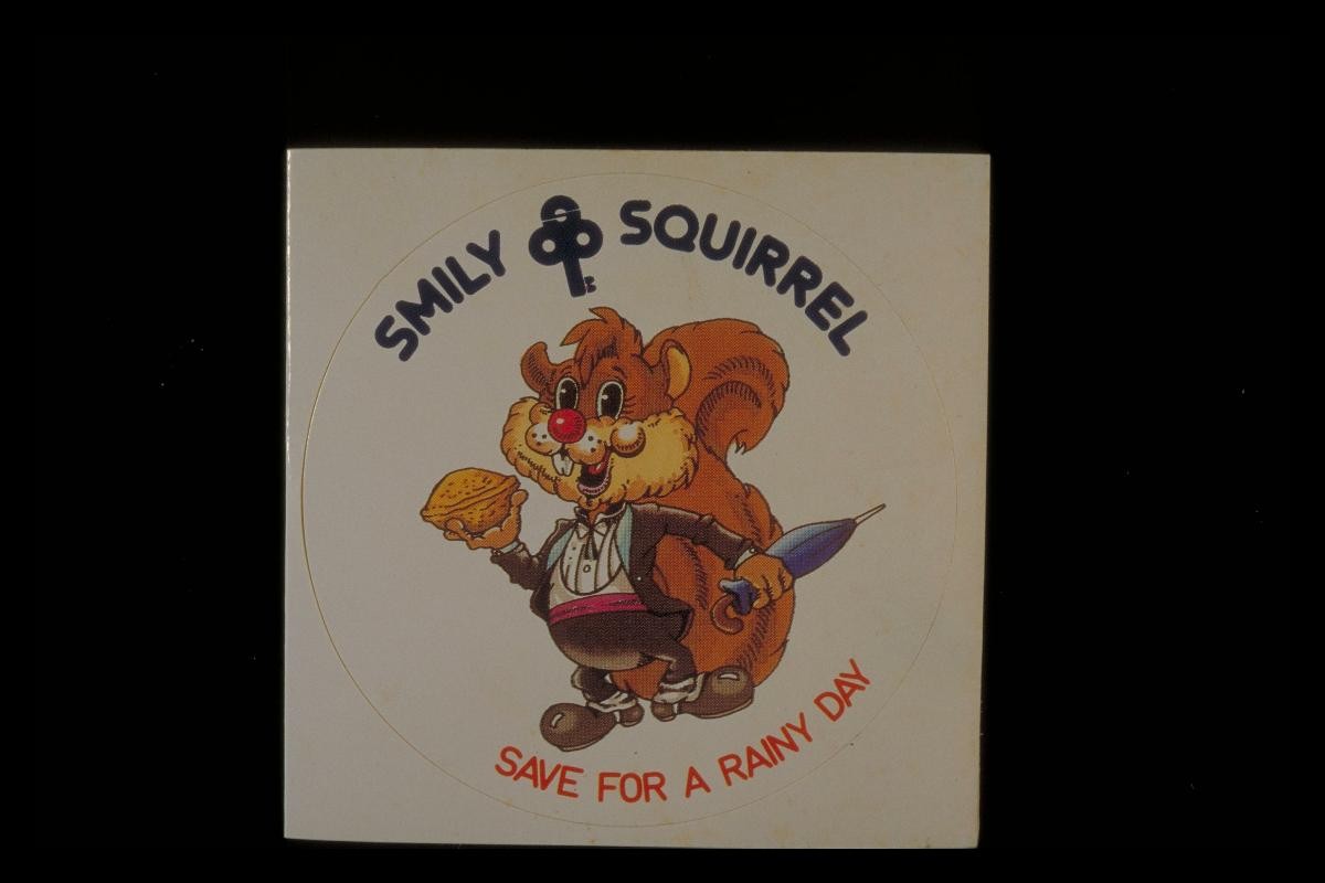 ‘Smiley Squirrel’ sticker with slogan, ‘Save for a rainy day’