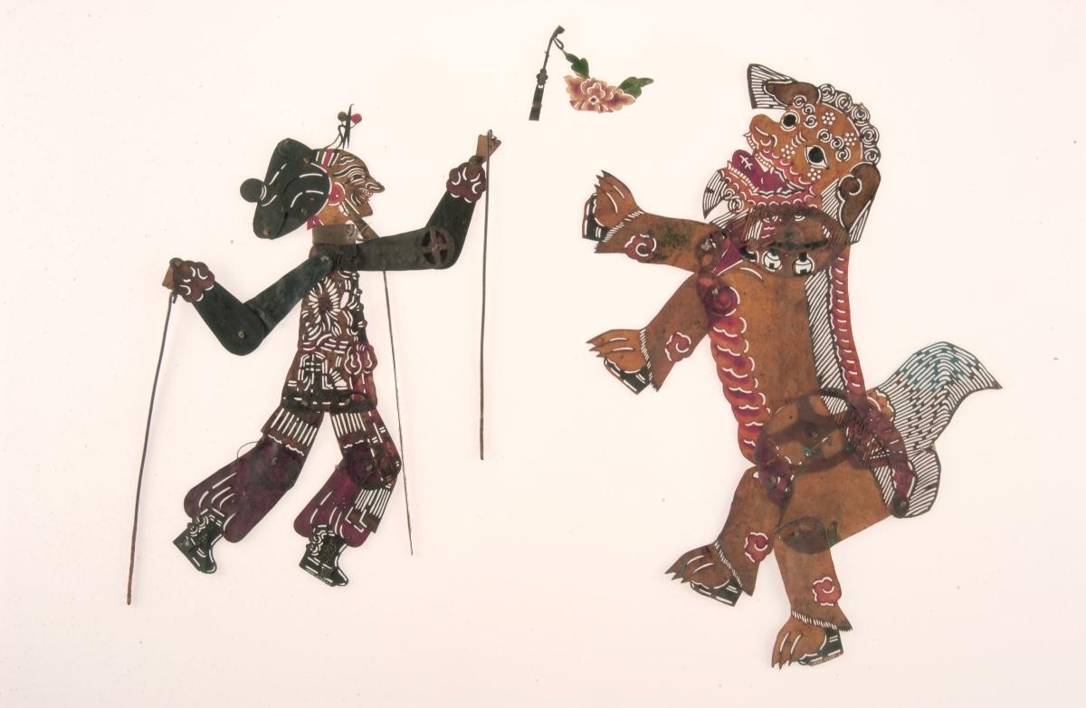 Shadow puppets, figure of man and lion