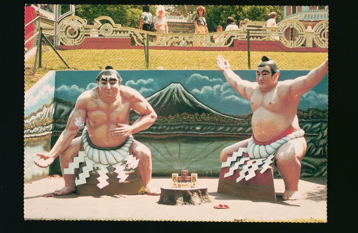 Statues of sumo wrestlers in the Japan Corner at Haw Par Villa