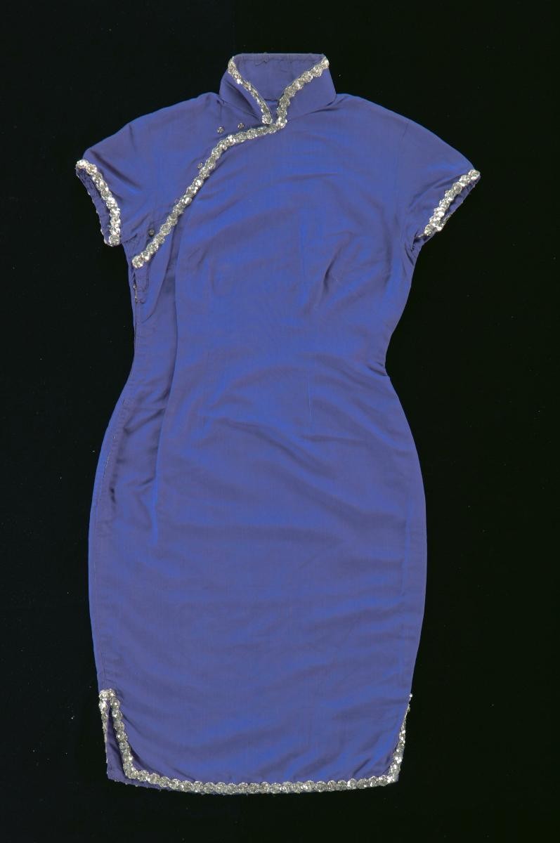 A violet cheongsam with silver sequined trimmings