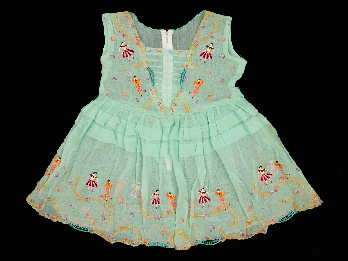 Green dress with muscial note details