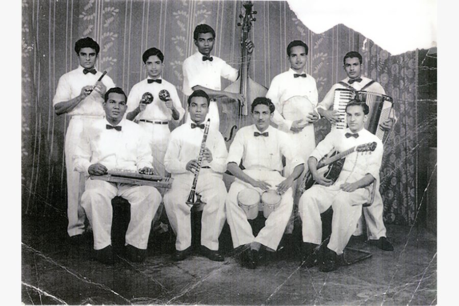 <a href="/assets/a70c08c7-40ae-44f7-b7d1-7857f4ef1506/simp.jpg"><strong>Photograph of Singapore Indian Music Party (SIMP) and the Edmund Appau Family band</strong></a><br>
1940s–1950s and 1970s, Singapore<br>
<em>Collection of the Family of Edmund Appau</em>