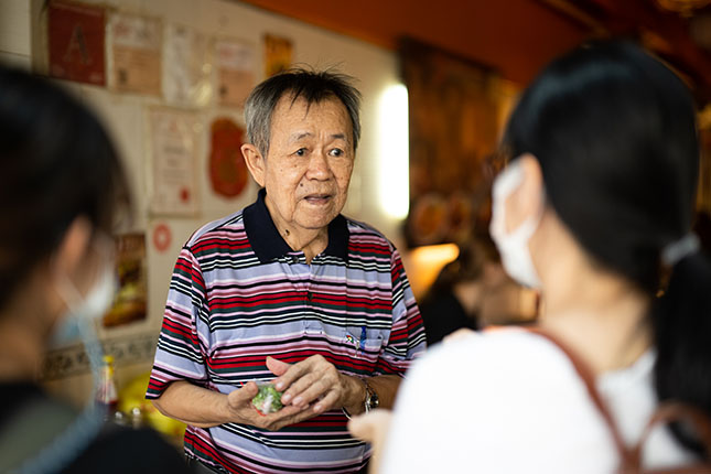 Owner with Interviewers at Prince Coffee House