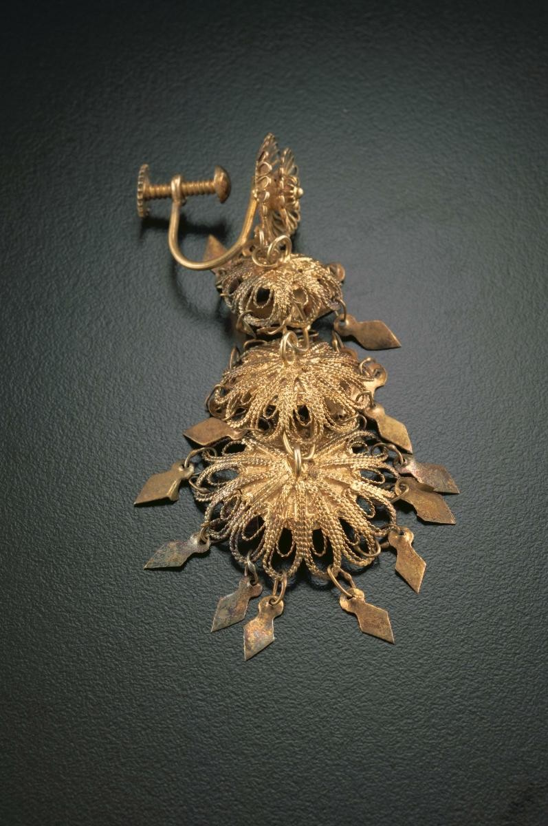 A pair of "golden leaf" ear rings that belonged to a notable women's rights activist