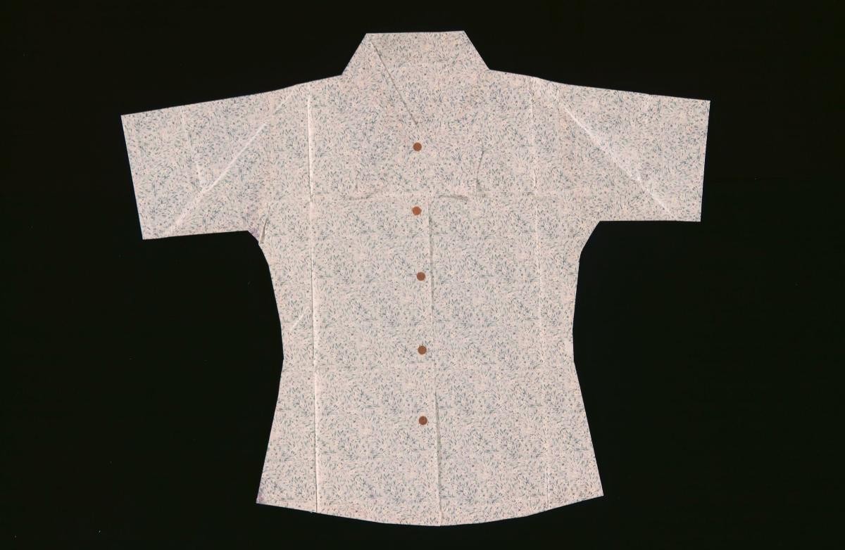 A white paper blouse with floral motifs