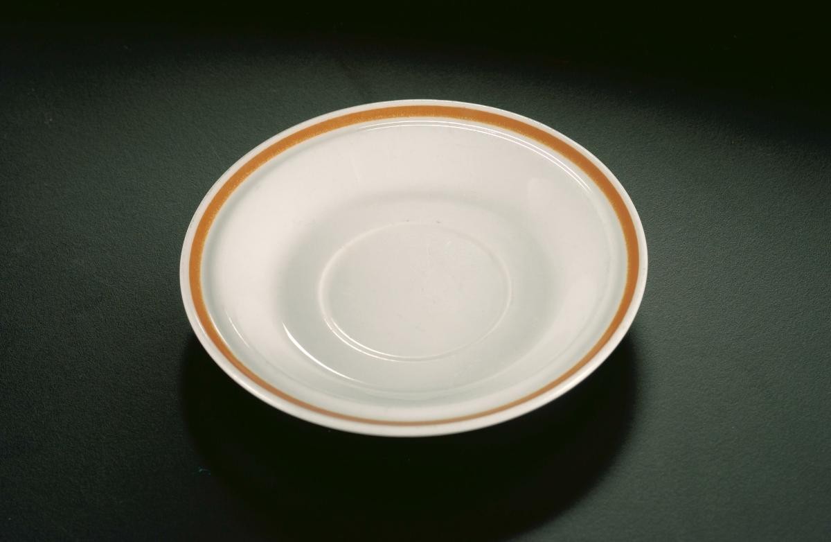 Plastic saucer from a breakfast set