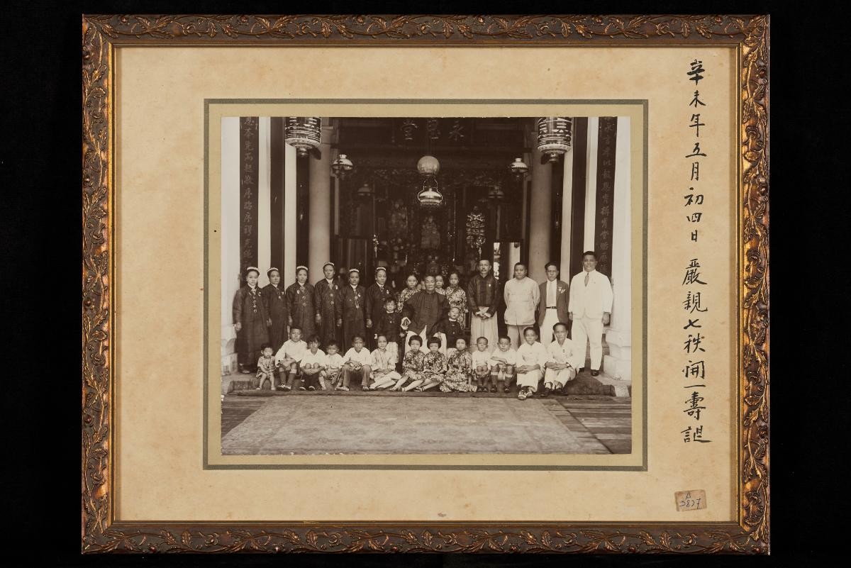 Photograph of a Peranakan family in ancestral hall