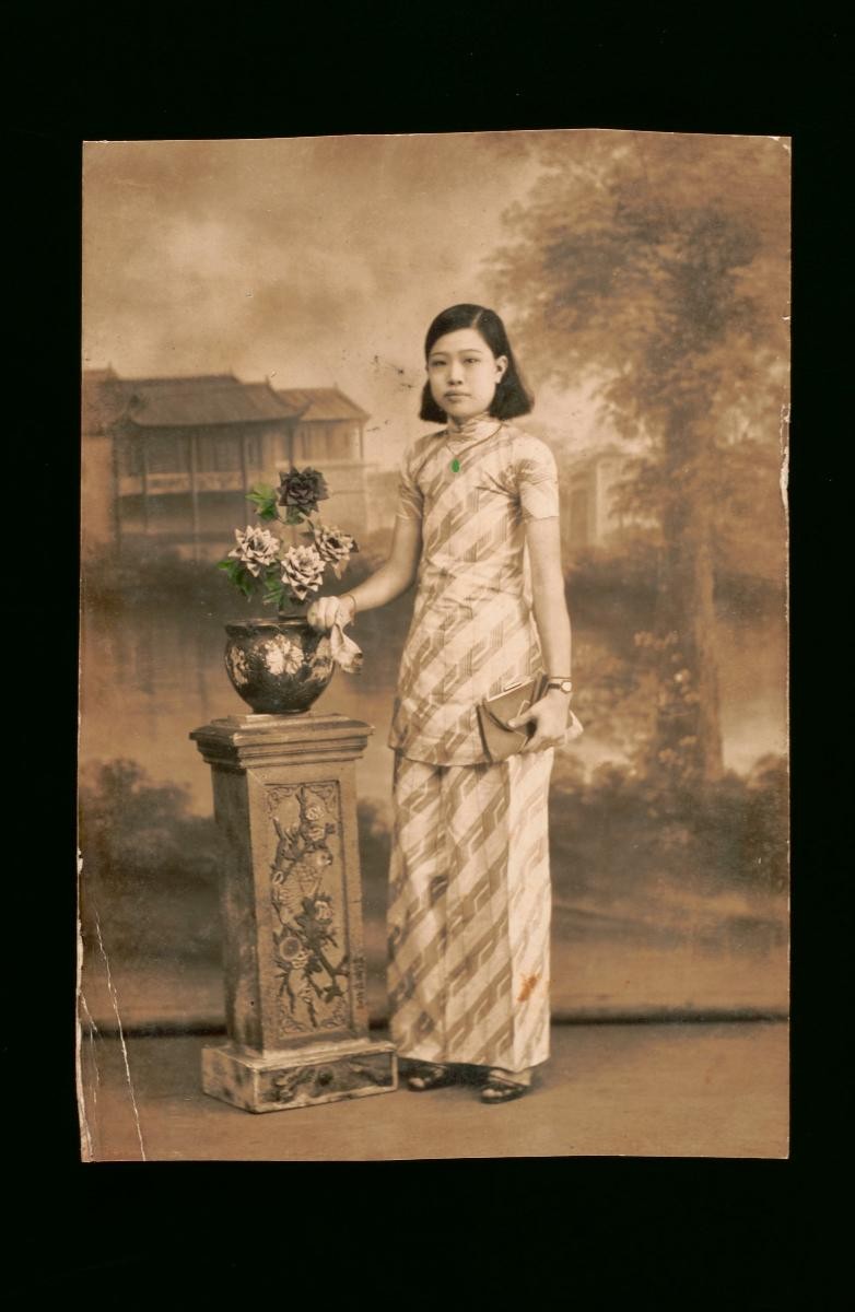 Studio portrait of a young Chinese woman