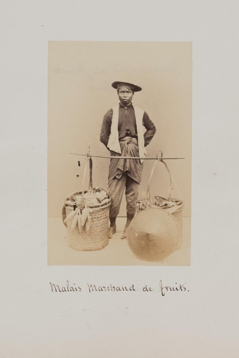 Portrait of a Malay street hawker selling fruits