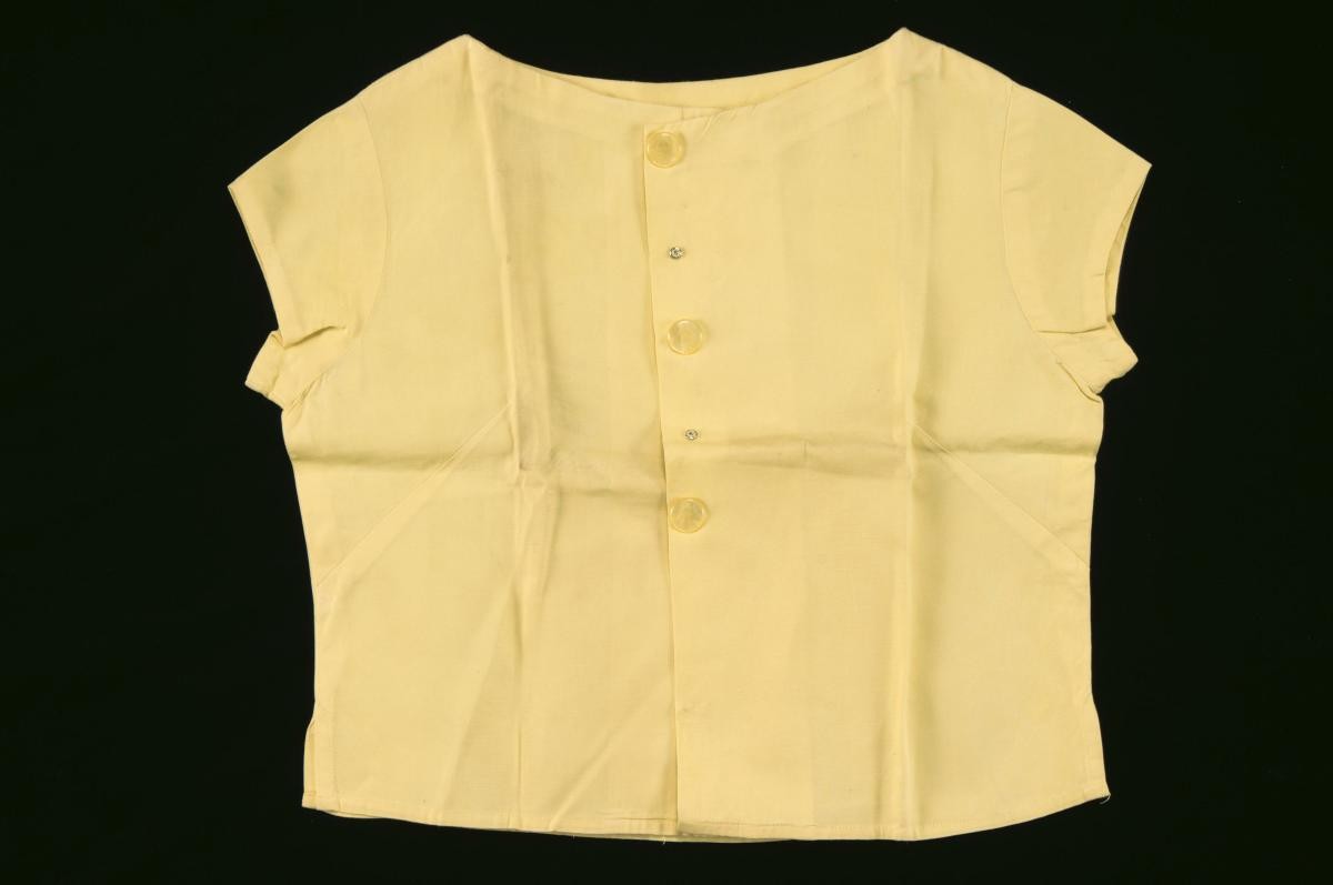 Yellow cap-sleeved top with plastic buttons