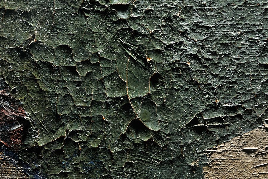 <strong>Damage: Craquelure and lifting paint seen on artwork before treatment</strong>