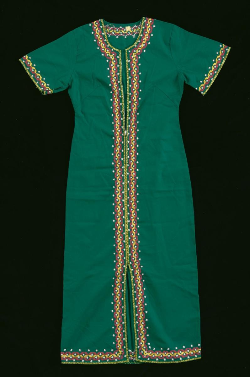 A green dress with yellow and red embroidery