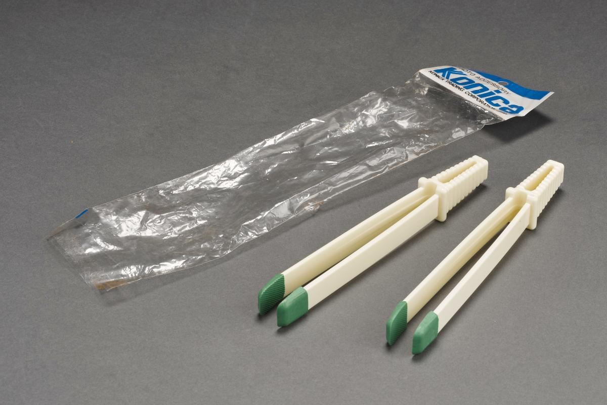 A pair of Konica film squeegees