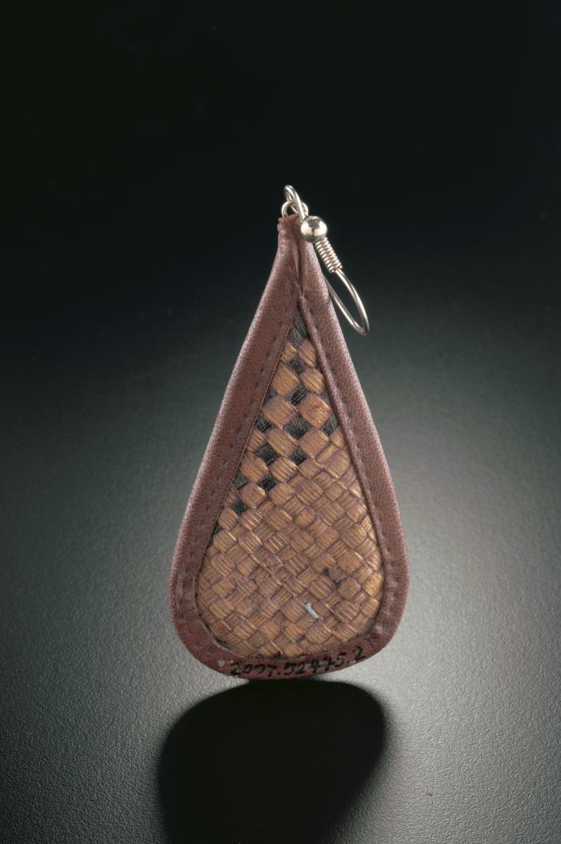 A pair of woven tear-drop shaped ear rings that belonged to a notable women's rights activist